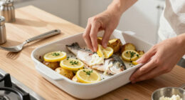 Rachel Roddy’s recipe for baked fish and potatoes with oregano and lemon mayonnaise | A kitchen in Rome